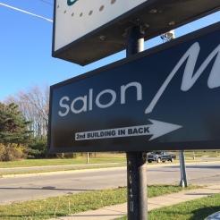 salon waukesha road sign